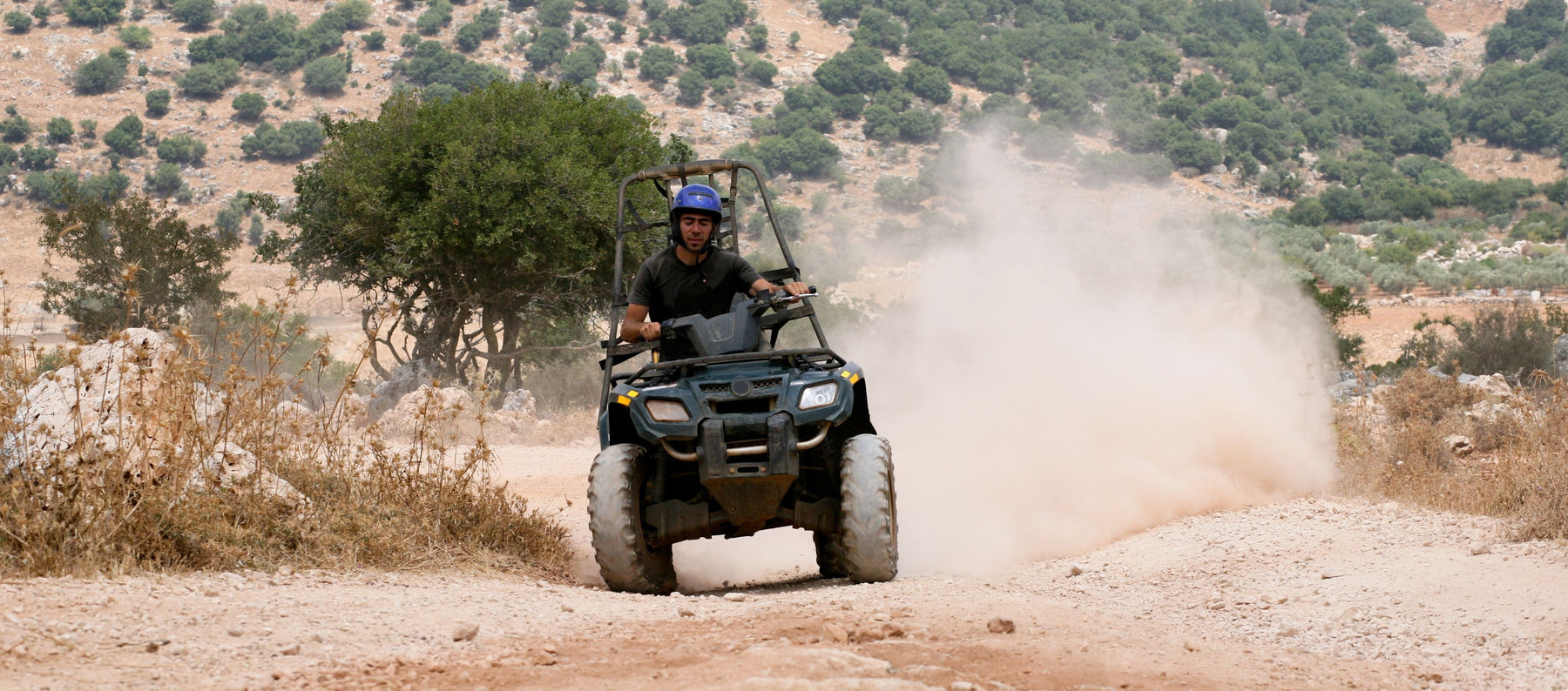 ATV riding on dirt road