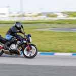 A motorcycle racer makes a practice run on a sports track